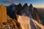 Jeff and Frederic Souchon look for a bivy spot whilst the sun sets on the Blatiere and Mont Blanc in the distance