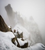 A Japanese climber in the final section of Arete des Cosmiques in deteriorating weather - Chamonix