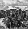 A bush plane flies over the Ramparts and the Kahiltna glacier - Alaska Range