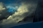 A subpeak of Mt Foraker shows through the mist above the Pica glacier - Alaska range