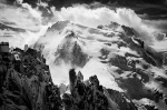 Mountaineers finish the classic Arete des Cosmiques with the north face of Mont Blanc du Tacul in the background - Chamonix