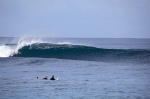 Douggs and Brett sharing a moment while perfect lefts pass them by Mentawai Islands, West Sumatra - Photo Aki