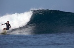 Douggs with a cruisy bottom turn in near perfect conditions in the Mentawai Islands, West Sumatra - Photo Aki