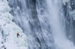 Neil Gresham on the half frozen waterfall of Montmorency falls in Quebec