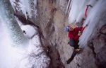 Neil Gresham swinging onto the fragile icicle of Amphibian a climb in Vail Colorado USA