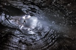 Climbing out of a Maelstrom in one of the shafts in Boxhead Pot, Yorkshire Dales