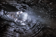 Climbing out of a Maelstrom in one of the shafts in Boxhead Pot, Yorkshire Dales